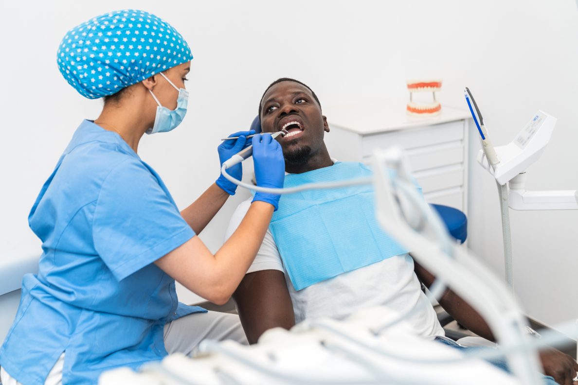 Dental hygienist performing professional teeth cleaning